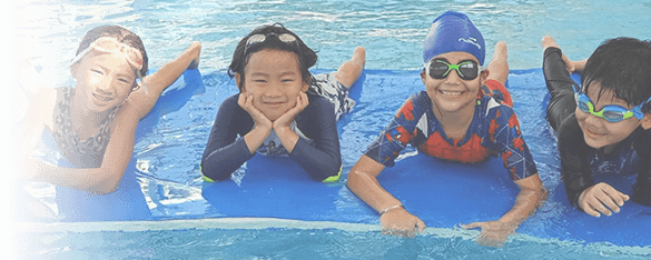 young boys and girls having fun in a swim lesson at BEST Bangkok