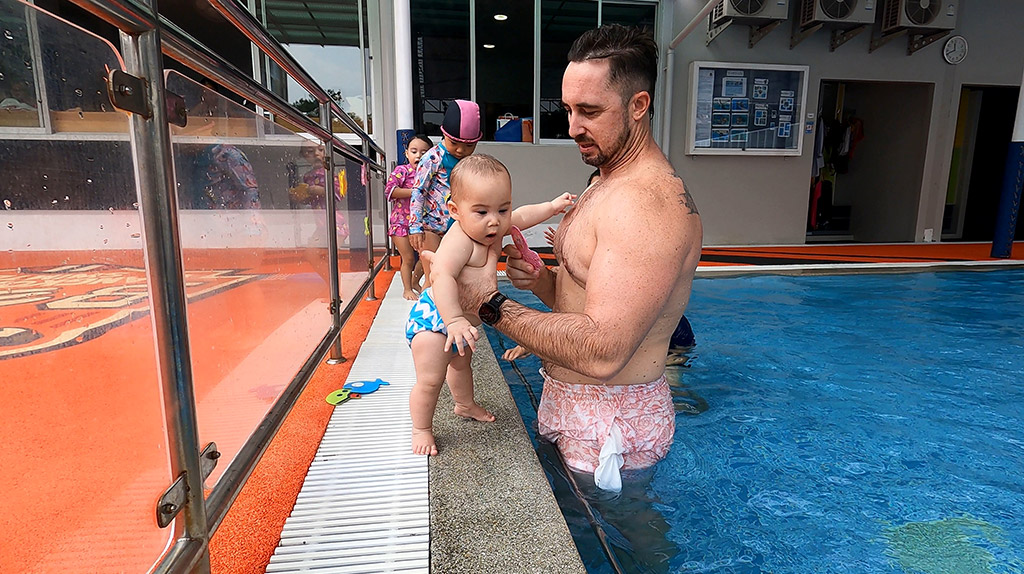 baby with dad enjoying a baby swim class at BEST in Bangkok